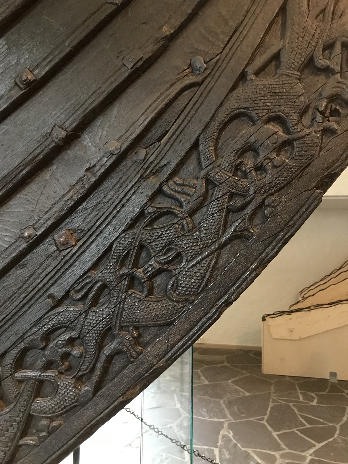 a picture of carvings on the prow of a viking longship